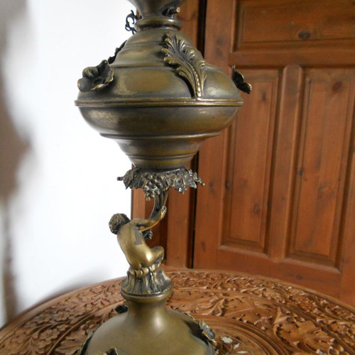Bronze table lamp with putto used, authentic antique