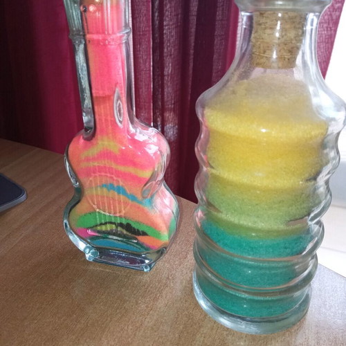 Glass decorative containers with artistic details