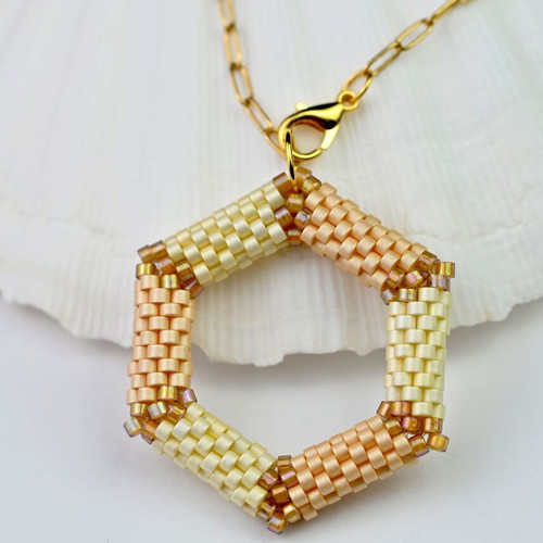 Delicate beige necklace with hexagonal pendant custom made