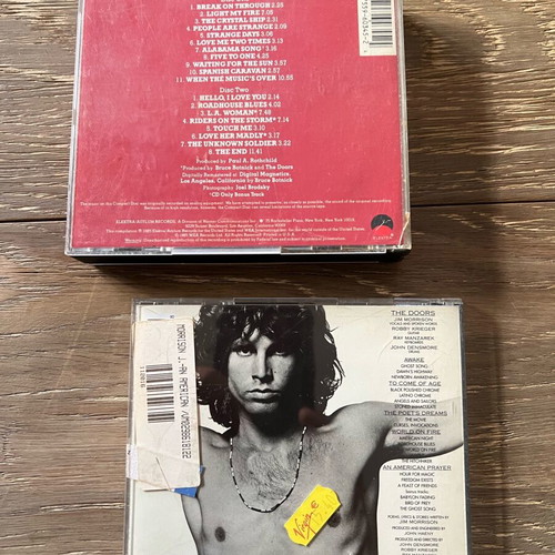 The Doors CDs used, one double and one single