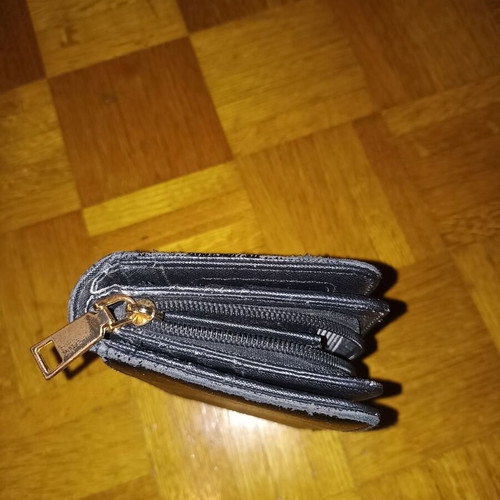 Black wallet slightly used with multiple compartments
