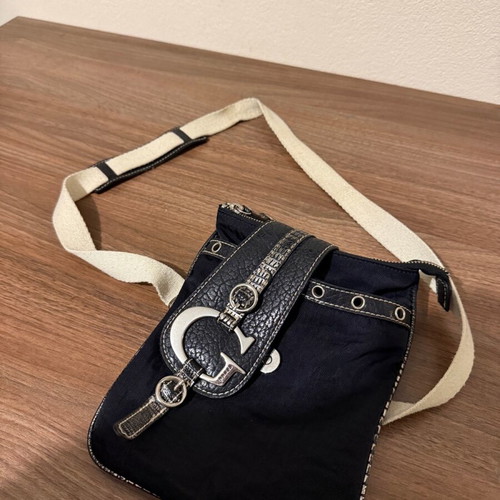 Guess women's leather crossbody bag used, waterproof, black and white