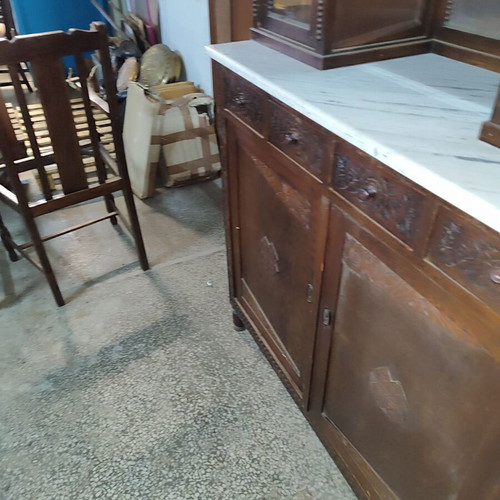 Carved antique buffet used with marble top and mirror