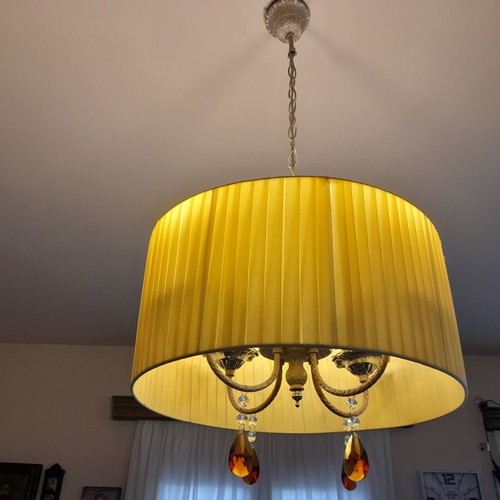 Ceiling light with brass parts and yellow lampshade