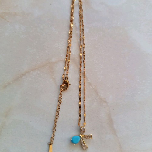 Necklace with silver-plated chain and bow design with turquoise stone like new