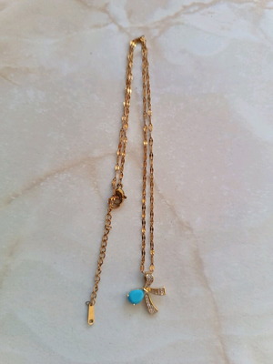 Necklace with silver-plated chain and bow design with turquoise stone like new