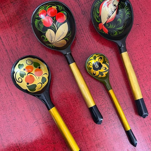 Decorative spoons used, set of 4 wooden with folk motifs