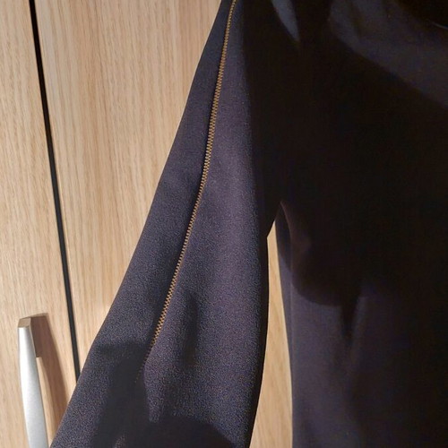 Mini black dress like new with zipper and gold details
