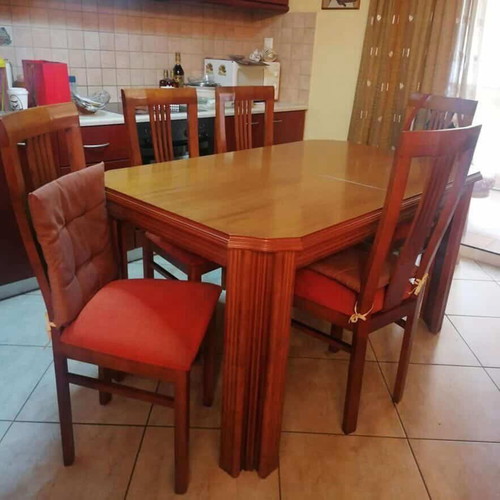 Wooden dining table with 6 chairs used, extends to 12 people