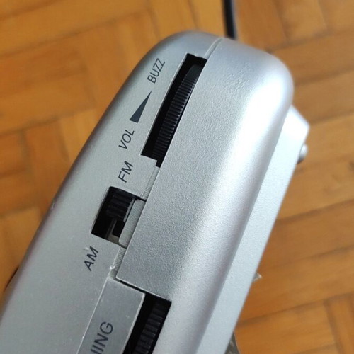 Digital alarm clock used with radio and minor display lines