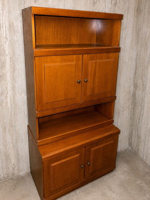 Wooden cabinet with shelves and cupboards