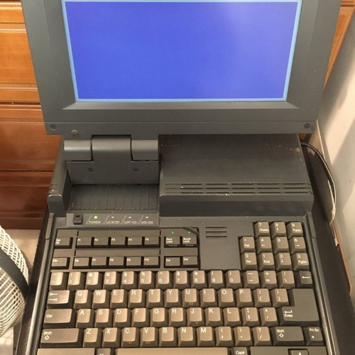 Sharp PC-4500 laptop collectible with charger