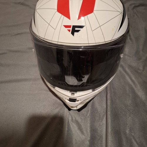 Motorcycle helmet with visor, used