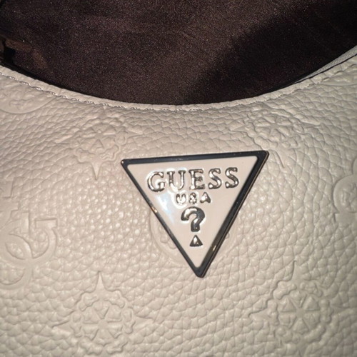 Guess white shoulder bag used with embossed logo pattern