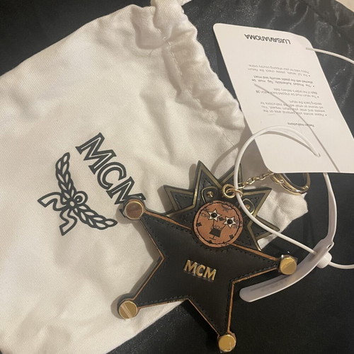 MCM Star Lion bag charm new, black and brown