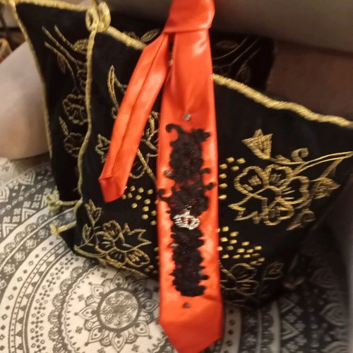 Red tie like new with pearls