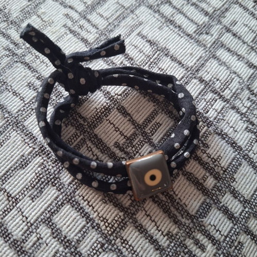Fabric bracelet with eye pattern like new, black and grey