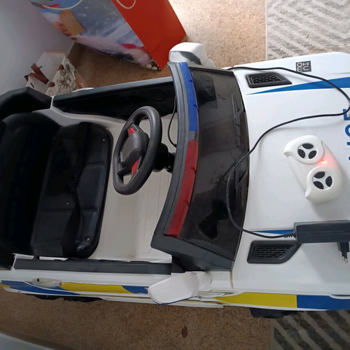 Children's police toy car like new with charger and remote control