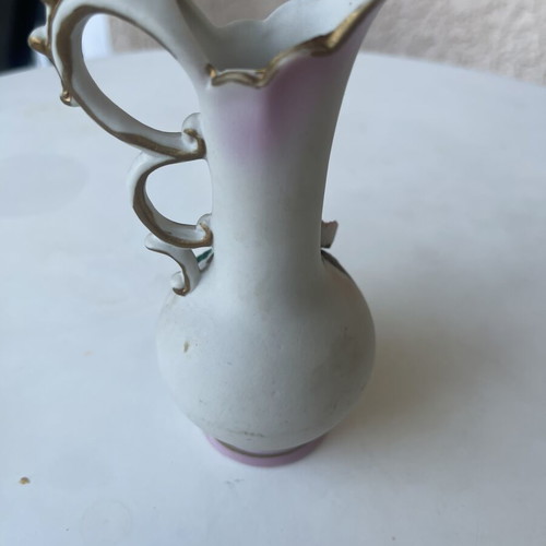Vintage ceramic pitcher with embossed flowers used