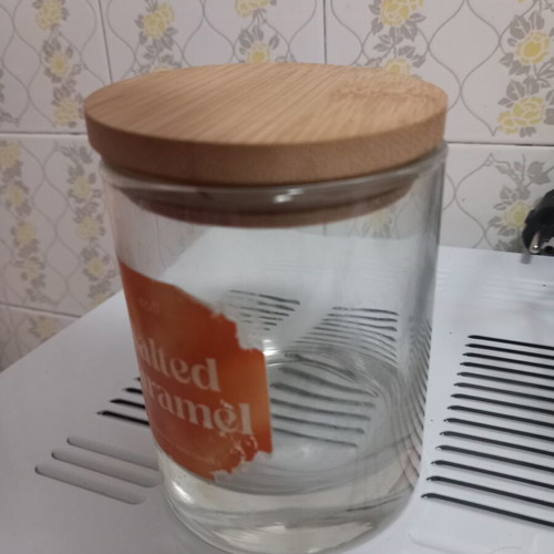Candle container with wooden lid