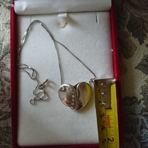 Silver heart-shaped pendant like new