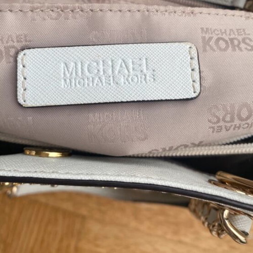 Michael Kors white tote bag with floral and dragonfly details