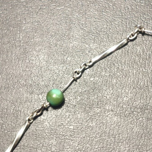 Silver bracelet with green beads used, needs repair