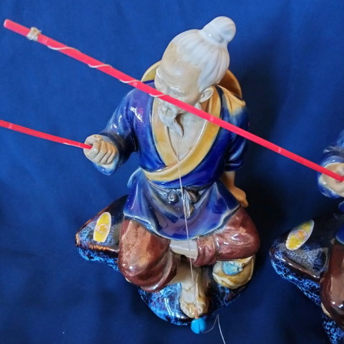 Decorative porcelain figurines used, two Chinese fishermen