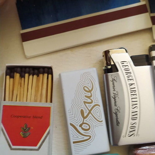 Vintage smoking collection with lighters, filters & rolling papers