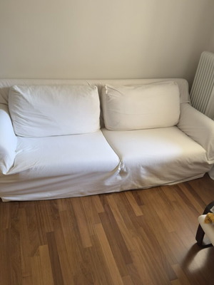Three-seater sofa with solid wood frame