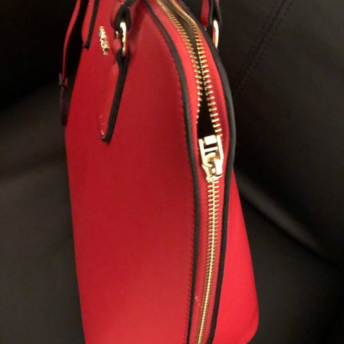 Red handbag used with wear marks
