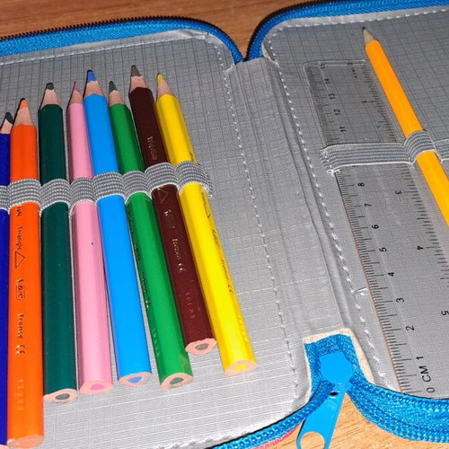 Children's pencil case used with colored pencils in good condition