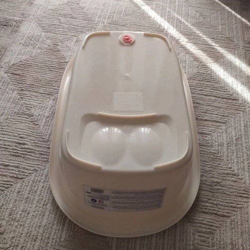 Baby Bathtub like new, beige with anti-slip surface and drain plug
