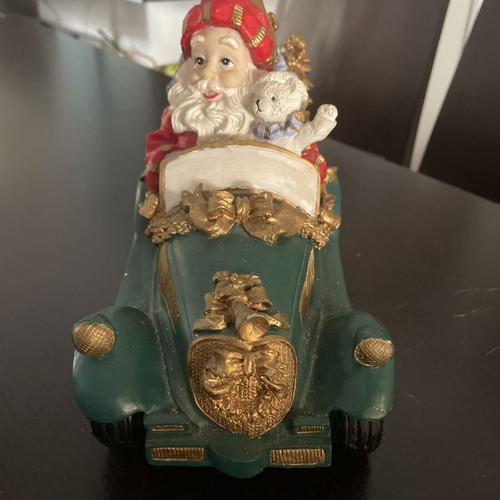 Christmas decoration Santa Claus in vintage car like new