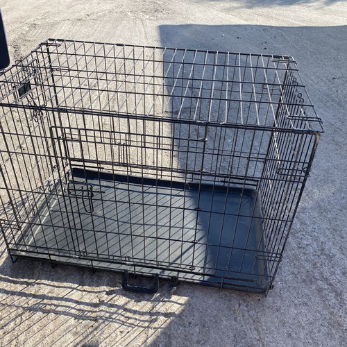 Dog crate used for a large dog with two doors and cleaning tray