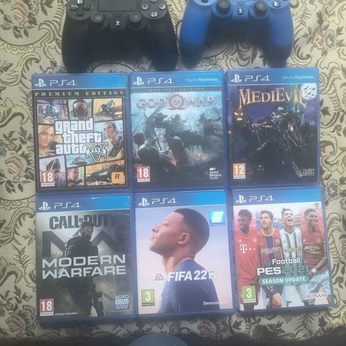 PlayStation 4 Slim 1TB used with 6 games and 2 controllers
