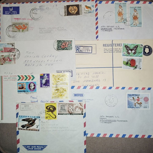 Collection of envelopes and stamps from around the world, new