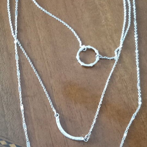 Necklace new with 3 chains and 1 clasp in silver color