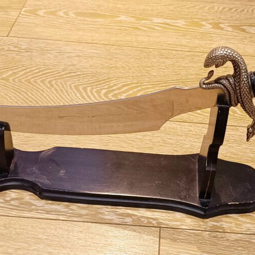 Decorative Gothic sword like new with wooden base