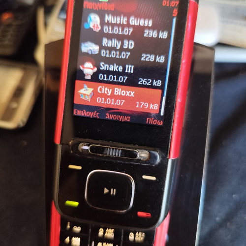 Nokia 5610 XpressMusic phone used with charger