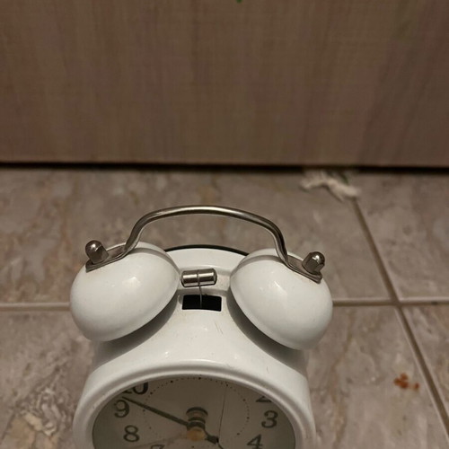 Table clock used, white with crack
