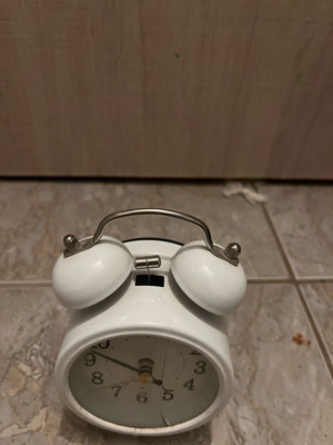 Table clock used, white with crack