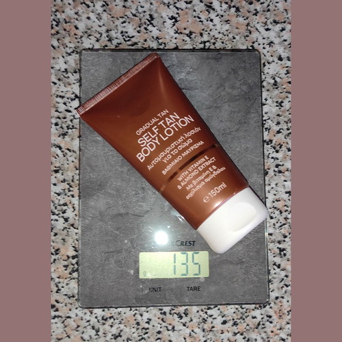 Self Tan body lotion used with vitamin E and almond extract