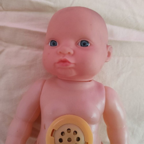Plastic laughing doll 25cm like new