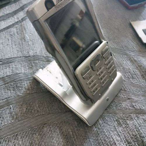 Sony Ericsson P 990i vintage mobile phone used with dock and charger