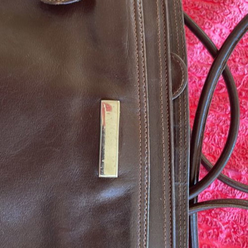 Brown leather Napa bag used with multiple compartments