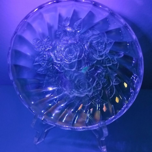 Vintage iridescent glass plate with embossed rose design