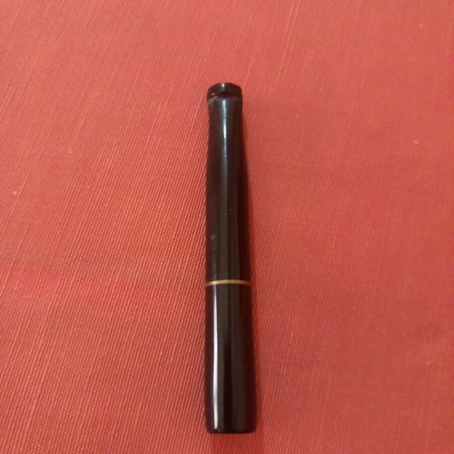 Cigarette holder used for regular cigarettes, not slim