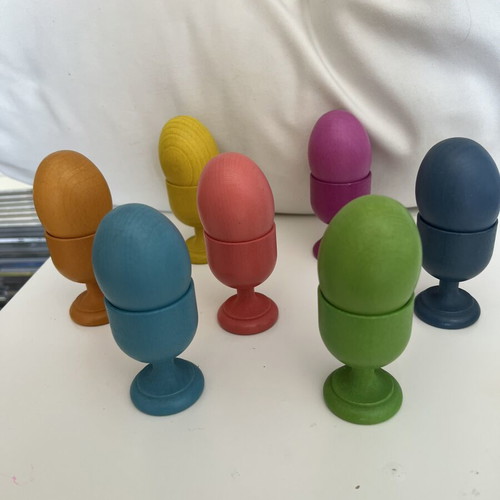 Wooden baby toy with colored eggs and egg cups