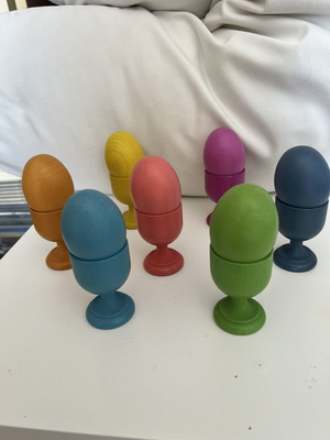Wooden baby toy with colored eggs and egg cups